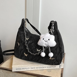 Black pleated hobo tote bag with silver chain, butterfly charms and cloud pendant
