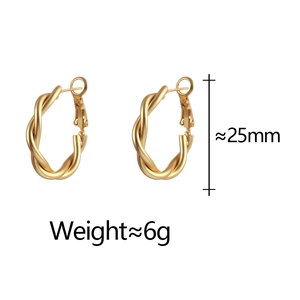 Detailed view of 25mm gold twisted hoop earrings with elegant matte texture and 6g weight