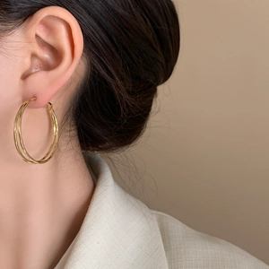 Minimalist double layered gold hoop earrings with a polished mirror finish for women