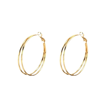 Minimalist double layer gold hoop earrings featuring a layered oversized circular design