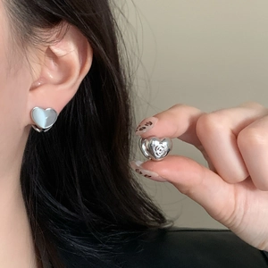 Minimalist silver heart stud earrings featuring white cat eye stone and hollow rose pattern