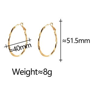 Detail view of 40mm gold twisted hoop earrings with size and weight measurements