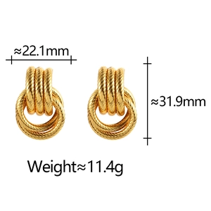 Detail view of twisted gold hoop earrings showing size 22.1x31.9mm and 11.4g weight