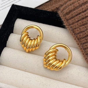 Vintage gold hoop earrings with spiral detail in a premium velvet jewelry display box
