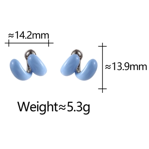 Detailed view of light blue enamel C-shape stud earrings with silver metal joints