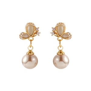 Elegant butterfly stud earrings with cat eye stones and champagne pearls on white background
