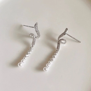 Elegant silver wave drop earrings with sparkling zircons and three hanging white pearls