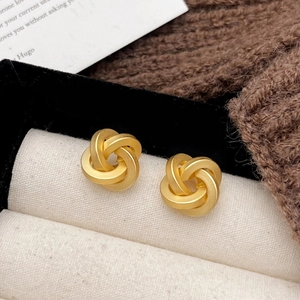 Elegant matte gold twisted knot earrings with interlocking three-ring design for women