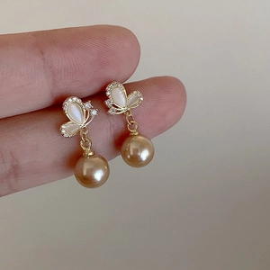 Elegant butterfly stud earrings with opal stone and champagne pearls in gold finish