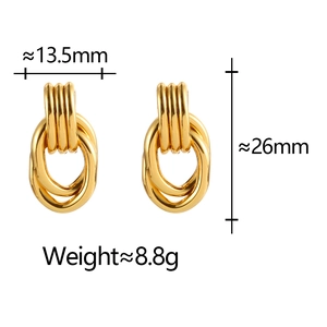 Detail view of layered gold geometric twisted earrings showing 26mm height and size specs