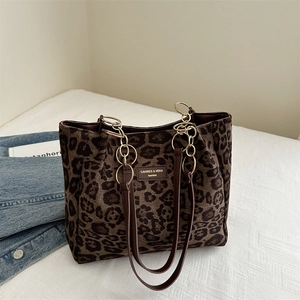 Large leopard print tote bag with suede texture and brown leather straps for autumn fashion