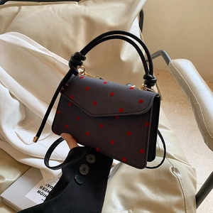 Chic dark grey polka dot handbag with red spots and gold-tone hardware for women