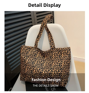 Detail shot of leopard print canvas tote bag with spacious interior and durable handles
