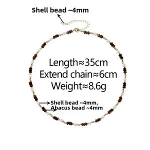 Close-up of shell and wood beads necklace with 35cm chain and 6cm extender details