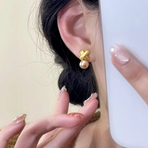 Elegant gold-plated criss-cross X design stud earrings with white round pearls
