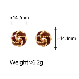 Detail of red enamel spiral earrings with gold trim including dimensions and weight