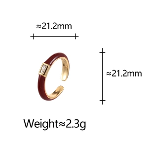 Macro detail of red enamel gold open ring with cubic zirconia showing 21.2mm size