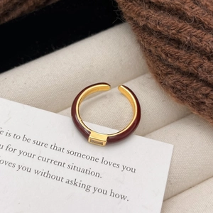 Adjustable gold open ring with burgundy enamel and a rectangular zircon crystal