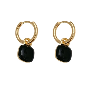 Elegant gold drop earrings featuring square black gemstones on white background