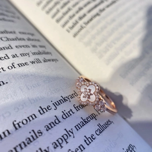 Rose gold adjustable clover ring with pink mother-of-pearl and sparkling zircon accents