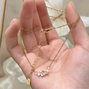 Exquisite 18K gold-plated geometric zircon necklace with three stones on a delicate chain