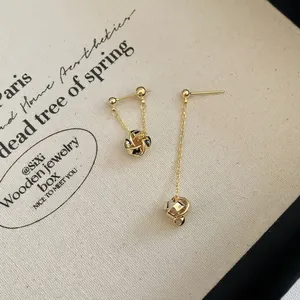 Elegant gold twisted geometric spiral tassel drop earrings with asymmetric chain design