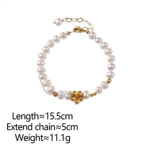 Detail of freshwater pearl bracelet with matte gold flower charm and size markings