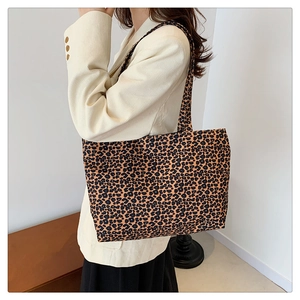 Detailed view of the leopard print canvas tote bag with wide straps for women