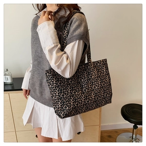Detail of large leopard print tote bag in durable canvas with wide shoulder strap