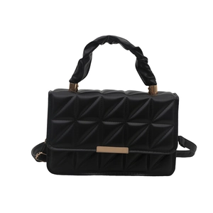 Elegant black quilted shoulder bag with ruched handle and golden hardware on white background