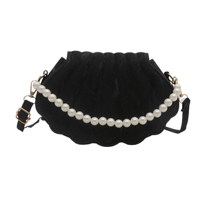 Elegant black shell-shaped velvet crossbody bag with luxury pearl handle and gold accents