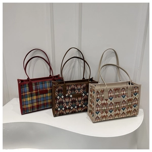 Three large knit tote bags with colorful plaid and geometric patterns for women