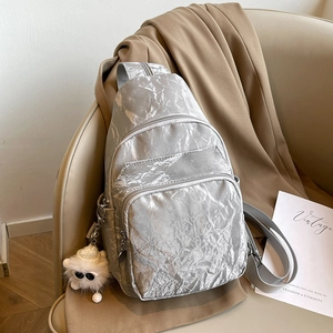 Versatile silver wrinkled chest bag for women with owl charm and multiple zipper pockets