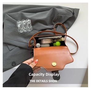 Detailed interior view of a brown vintage crossbody bag showing daily essentials storage