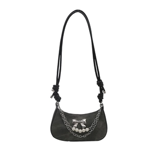 Vintage grey hobo bag with silver bow accent, pearl chain detail, and minimalist shoulder strap