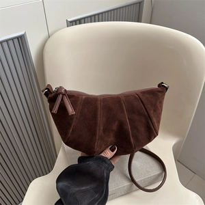 Retro dark brown suede crescent bag with pleated design and knotted zipper details