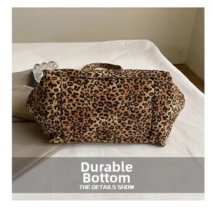 Close-up of leopard print tote bag featuring a reinforced wear-resistant bottom base