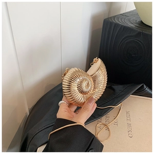 Exquisite gold shell-shaped clutch bag with spiral ridges and delicate metal chain strap