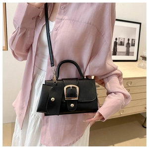 Classic black leather crossbody square bag with gold buckle and a mini charm pouch