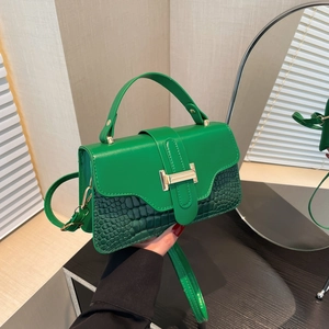 Green leather crossbody bag with crocodile pattern and golden metal buckle decoration