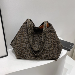 Stylish large leopard print canvas tote bag with front pocket and dual top handles