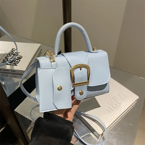 Light blue mini square handbag with gold buckle and matching small coin purse detail