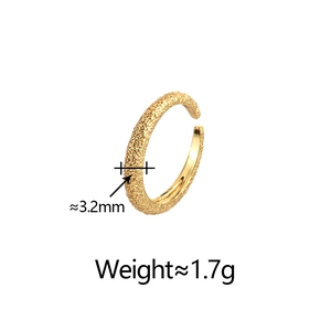 Detail shot of golden irregular wrinkled ring showing 3.2mm width and hammered texture