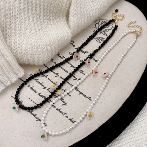 French floral necklace set with colorful crystal flowers and elegant white pearls