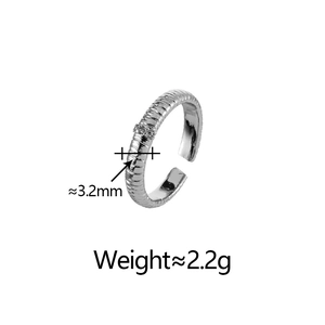 Detail view of 3.2mm wide silver ring with pleated texture and micro-inlaid cubic zirconia