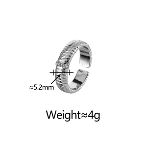 Detail shot of textured silver ring with zircon inlay showing 5.2mm width and 4g weight