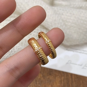 French vintage gold ribbed rings set with shimmering zircons in a layered open style
