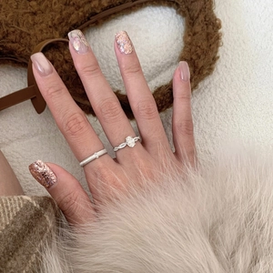 Sparkling zircon silver rings with twisted band and frosted texture worn on finger