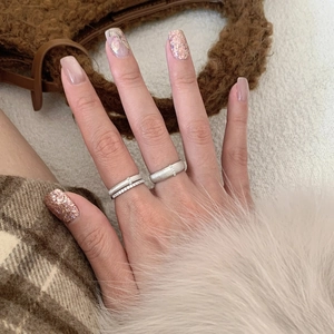 Modern wide textured silver rings with zircon accents on a cozy winter background
