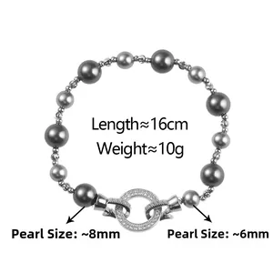 Detail of dark grey pearl bracelet with zircon encrusted toggle clasp and measurements